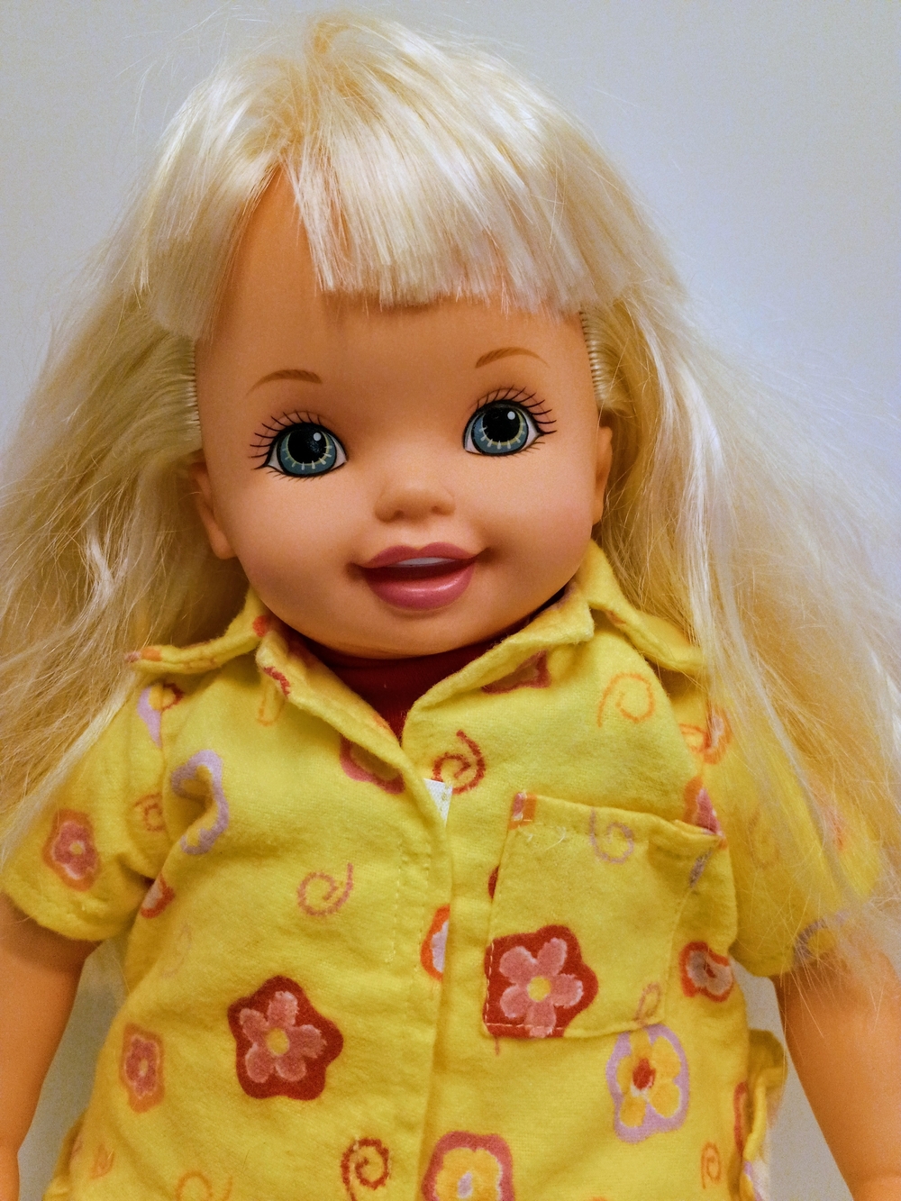 Mattel Blonde Baby Doll in Yellow Floral Pajama Top